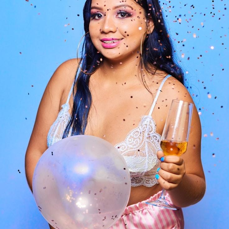 Ava Moore, Lead Design Curator at Universal Operations Hub, reviewing corporate floral arrangements